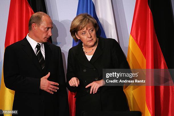 German Chancellor Angela Merkel and Russian President Vladimir Putin attend a news conference after bilateral talks on October 10, 2006 in Dresden,...