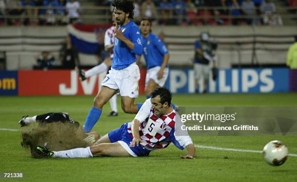 Milan Rapaic of Croatia brings up the turf during the FIFA World Cup Finals 2002 Group G match between Italy and Croatia played at the...