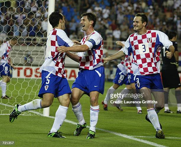 Milan Rapaic of Croatia celebrates scoring the winning goal with team-mate Robert Jarni during the FIFA World Cup Finals 2002 Group G match between...