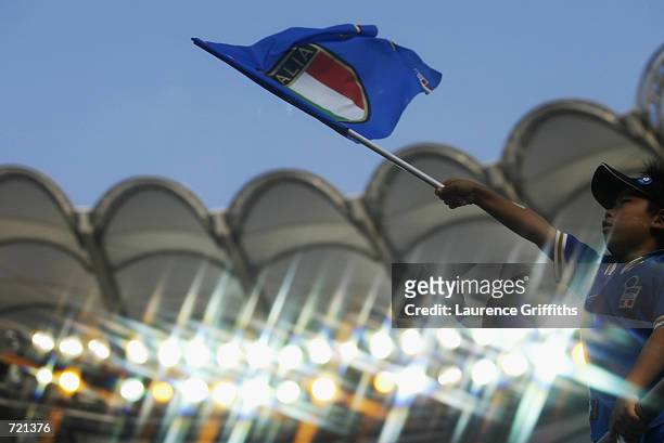 Young Italy fan waves his flag during the FIFA World Cup Finals 2002 Group G match between Italy and Croatia played at the Ibaraki-Prefecutural...