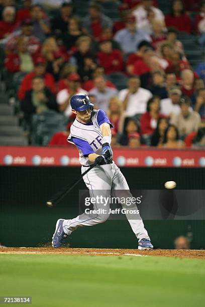 Michael Young of the Texas Rangers swings at the ball against the Los Angeles Angels of Anaheim at Angel Stadium during the game on September 25,...