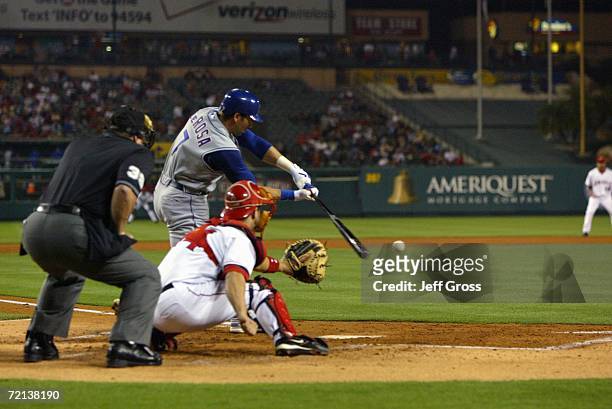 Mark DeRosa of the Texas Rangers swings at the ball against the Los Angeles Angels of Anaheim at Angel Stadium during the game on September 25, 2006...