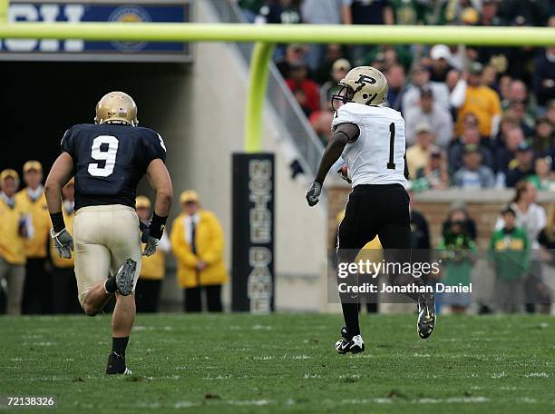 Wide receiver Selwyen Lymon of the Purdue Boilermakers runs 88 yard touchdown reception in the second quarter against Tom Zbikowski of the Notre Dame...