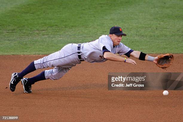 Infielder Brandon Inge of the Detroit Tigers is unable to field a hit by Milton Bradley of the Oakland Athletics during the first inning of Game One...