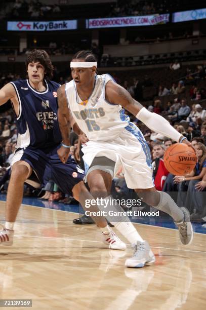 Carmelo Anthony of the Denver Nuggets goes to the basket against Efes Pilsen on October 10, 2006 at the Pepsi Center in Denver, Colorado. NOTE TO...