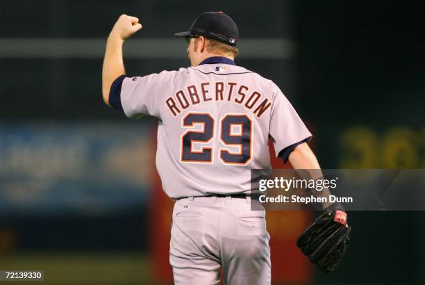 Starting pitcher Nate Robertson of the Detroit Tigers celebrates after outfielder Craig Monroe made a diving catch against the Oakland Athletics in...