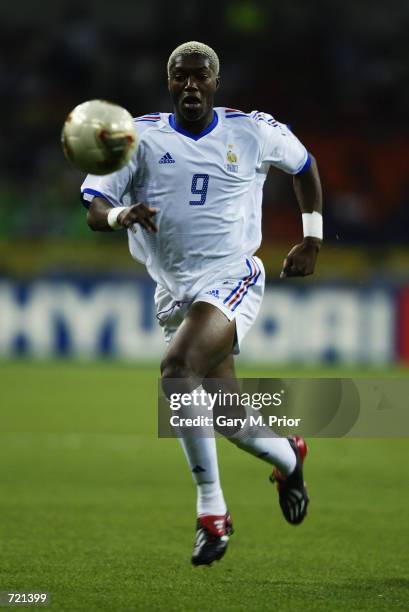 Djibril Cisse of France runs with the ball during the FIFA World Cup Finals 2002 Group A match between France and Uruguay played at the Asiad Main...