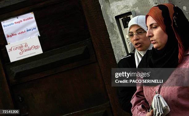 Arabic women wait outside the Naguib Mahfouz School, a private school mainly for Egyptian children whose curriculum includes Koran studies, in Milan,...