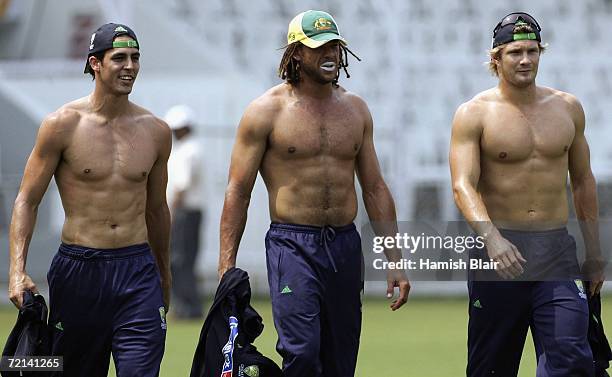 Mitchell Johnson, Andrew Symonds and Shane Watson of Australia look on during training at Brabourne Stadium on October 11 in Mumbai, India.