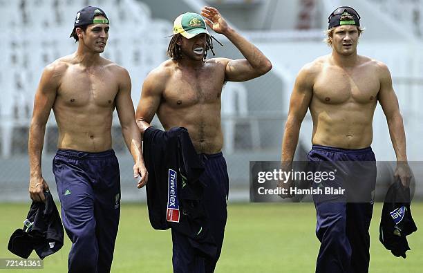 Mitchell Johnson, Andrew Symonds and Shane Watson of Australia look on during training at Brabourne Stadium on October 11 in Mumbai, India.