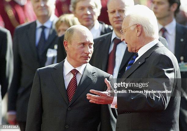 Russian President Vladimir Putin and Bavarian Prime minister Edmund Stoiber arrive at the Residenz on October 11, 2006 in Munich, Germany. Putin is...