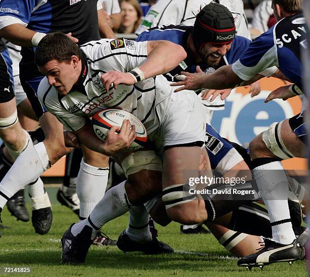 Ian Evans of the Ospreys bursts through the Bath defence during the EDF Energy Cup match between Bath and the Ospreys at the Recreation Ground on...