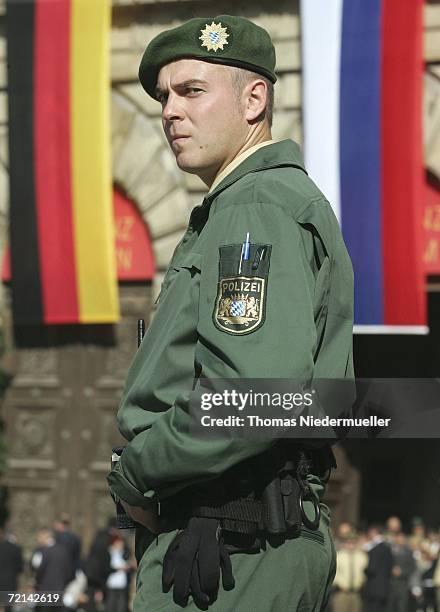 Policeman secures the meeting between Russian President Vladimir Putin and Bavarian Prime minister Edmund Stoiber at the Residenz on October 11, 2006...