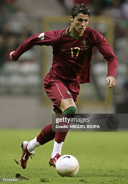Portugal's Cristiano Ronaldo runs with the ball during a Euro 2008 qualifying Group A football match against Azerbaijan at the Bessa Stadium in...
