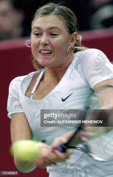 Moscow, RUSSIAN FEDERATION: Russian Maria Sharapova returns a ball to her compatriot Ekaterina Bychkova during their Kremlin Cup tennis tournament...