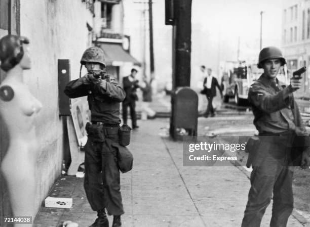 Members of the National Guard take aim during rioting in the Watts area of Los Angeles, during the Watts Riots, August 1965.