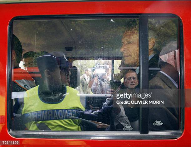 French Prime minister Dominique de Villepin is seen in a emergency workers' car, 11 October 2006 in the village of Zoufftgen near the Luxembourg...