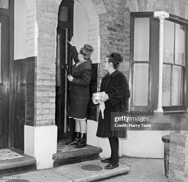 West Ham schoolgirls help the Womens Voluntary Service deliver hot Meals On Wheels to the elderly and housebound, 6th January 1964.