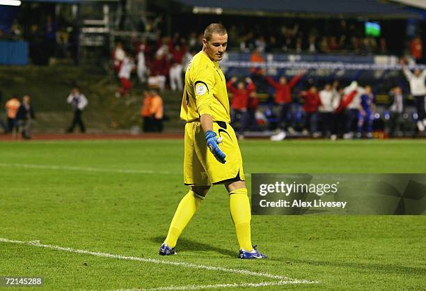 Paul Robinson of England looks in despair at a divot in the pitch after miss kicking a back pass to let the ball roll in for the second goal during...