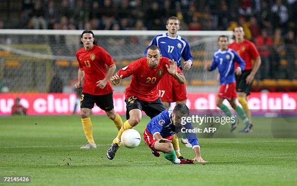 Belgium's Anthony Vanden Borre chases Azerbaijan's Yuri Muzika during their Euro 2008 qualifying soccer match, 11 October 2006, in Brussels. AFP...