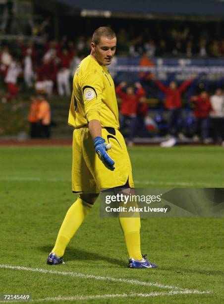 Paul Robinson of England looks in despair at a divot in the pitch after miss kicking a back pass to let the ball roll in for the second goal during...