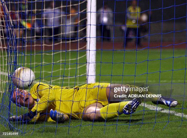 England's goalkeeper Paul Robinson lies in his goal after a looping header by Croatia's Eduardo Da Silva to score the opening goal during the Group E...