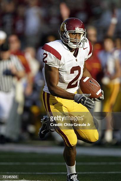 Wide receiver Steve Smith of the USC Trojans runs with the ball against the Washington State Cougars on September 30, 2006 at Martin Stadium in...