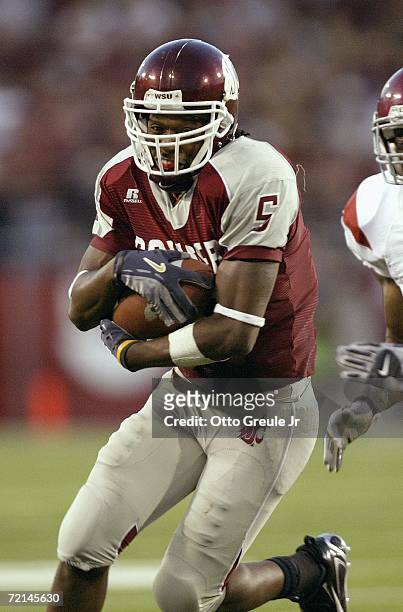 Wide receiver Michael Bumpus of the Washington State Cougars runs with the ball during the game against the USC Trojans on September 30, 2006 at...