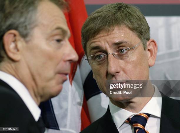 Hungary's Prime Minister Ferenc Gyurcsany talks with Britain's Prime Minister Tony Blair after speaking at an exhibit of photographs about the 1956...