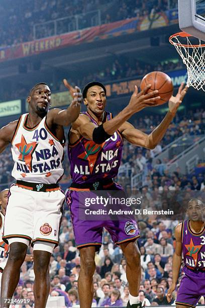 Scottie Pippen of the Eastern Conference All-Stars attempts a layup against Shawn Kemp of the Western Conference All-Stars during the 1995 NBA...