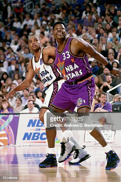 Patrick Ewing of the Eastern Conference All-Stars battles for position against Charles Barkley of the Western Conference All-Stars during the 1995...