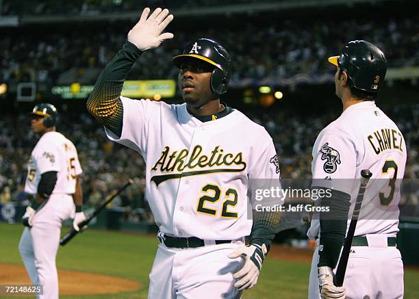 Milton Bradley of the Oakland Athletics celebrates after hitting a solo home run against the Detroit Tigers during Game Two of the American League...