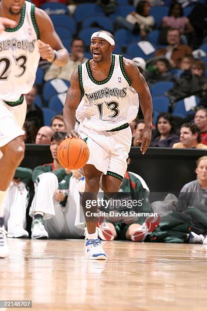 Mike James of the Minnesota Timberwolves pushes the ball up the court against the Milwaukee Bucks on October 11, 2006 at the Target Center in...