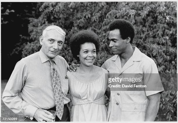 Black Panther Party members Kiilu Nyasha and co-founder Huey P. Newton pose with their lawyer Charles R. Garry on the campus of Yale University, New...