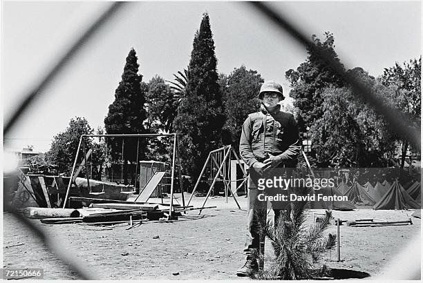 California National Guardsman is seen through a chain-link fence as he guards 'People's Park' from the people, Berkeley, California, May 30, 1969. On...