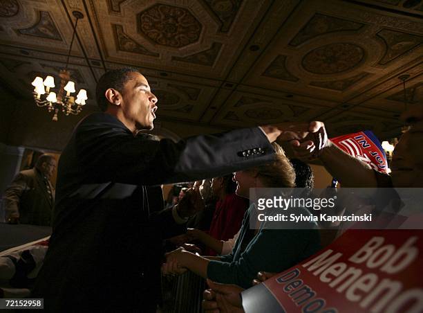 Senator Barack Obama shakes hands with voters at a rally for U.S. Senator Robert Menendez on October 12, 2006 at the Masonic Temple in Trenton, New...