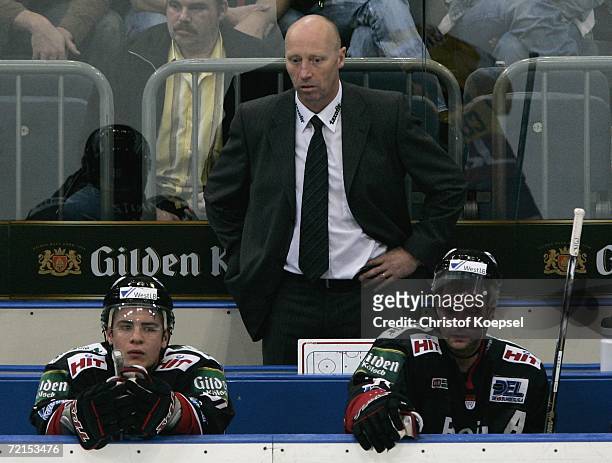 Haie's head coach Doug Mason, Sebastian Furchner and Tino Boos look disappointed during the DEL Bundesliga game between Cologne Haie and DEG Metro...