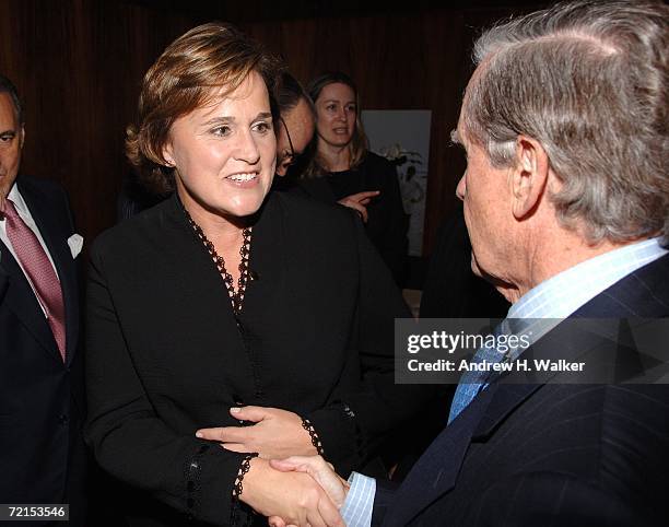 Author Doro Bush Koch greets James Robinson at a celebration for her book "My Father My President" on October 11, 2006 in New York City.