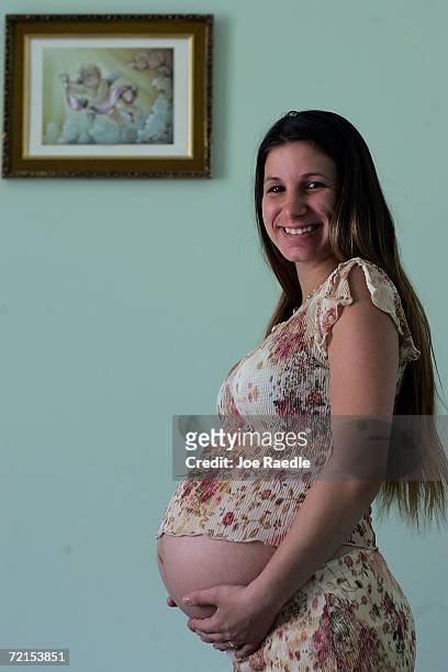 Bryttany Ferko who is nine months pregnant, poses with her belly before having an ultrasound examination at the Birthing Center of South Florida...