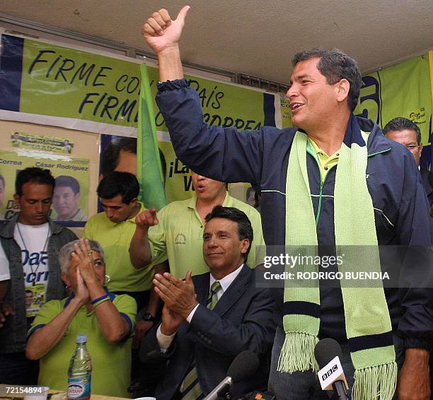 Presidential candidate Rafael Correa, of the Country Alliance party, waves at supporters as he arrives at his campaign headquarters in Quito, 12...