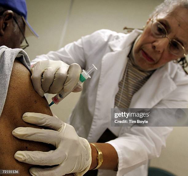 Robert Garner receives a flu shot, offered free by the city of Chicago from registered nurse Betty Lewis October 12, 2006 in Chicago, Illinois. In a...