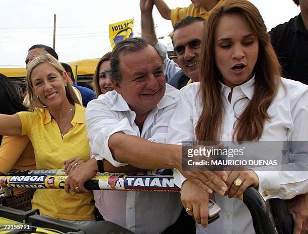 Presidential candidate Alvaro Noboa greets supporters on the campaigns' closing day 12 October in Guayaquil, Guayas Province, Ecuador. According to a...