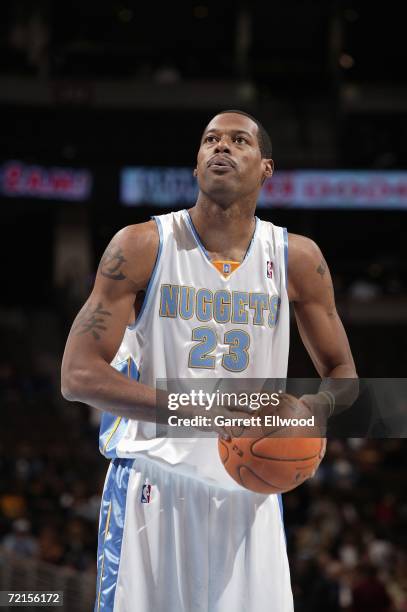 Marcus Camby of the Denver Nuggets prepares to shoot a free throw during a game against Efes Pilsen at the Pepsi Center on October 2, 2006 in Denver,...
