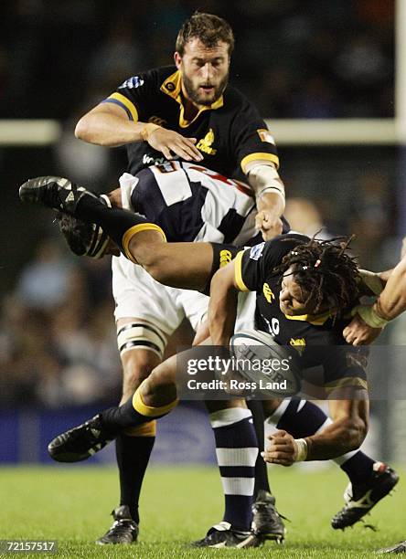Rodney So'oialo of Wellington tackled by Andrew Blowers as Luke Andrews looks on during the Air New Zealand Cup semi-final match between Auckland and...