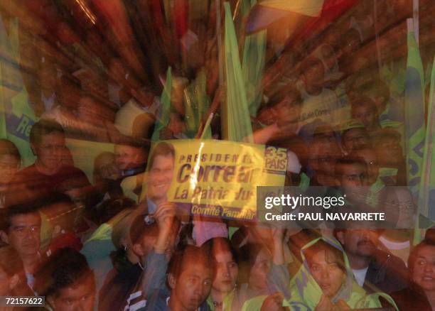 Supporters of Presidential candidate Rafael Correa, of the Country Alliance party, take part of the final rally of his campaign on October 12th in...