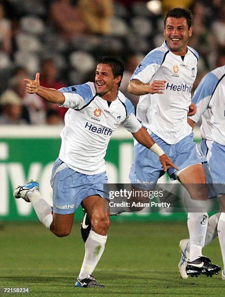Benito Carbone and Mark Rudan of Sydney FC celebrate Carbone's goal during the round eight Hyundai A-League match between the Central Coast Mariners...