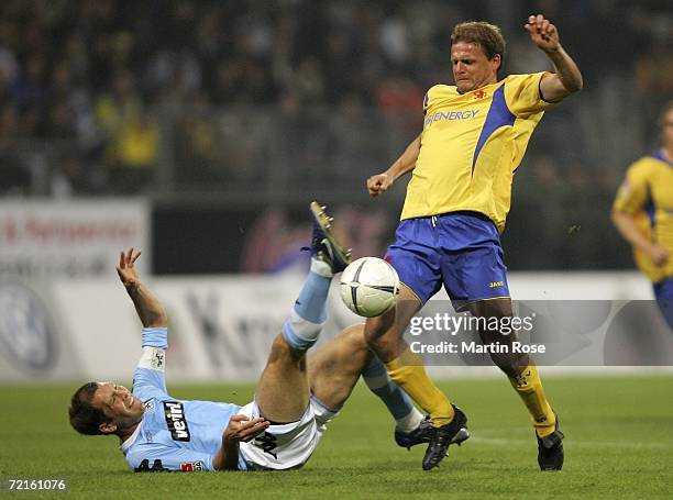 Gregg Berhalet of 1860 Munich and Juergen Rische of Braunschweig fight for the ball during the Second Bundesliga match between Eintracht Braunschweig...