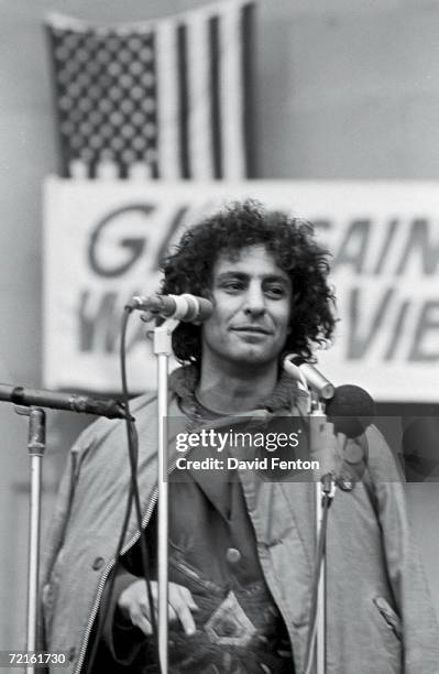 American political and social activist Abbie Hoffman speaks from behind a bank of microphones at a rally against the war in Veitnam, late 1960s or...