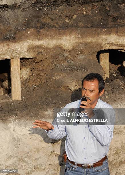 Mexican archaeologist Jose Alvaro Barrera talks to media about the three meter monolith which was found by Mexican archaeologists on the beginning of...