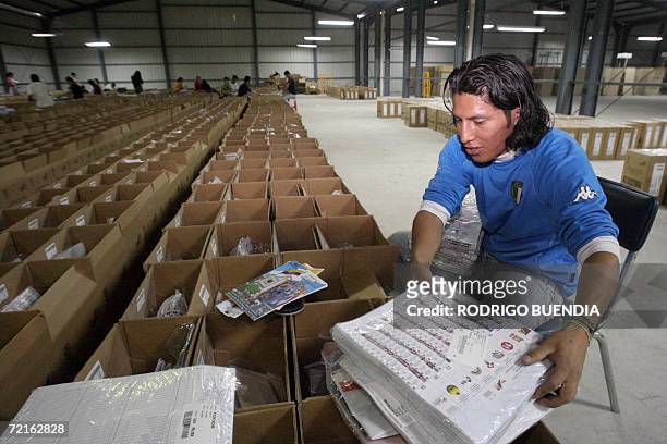An employee of the Electoral Supreme Tribunal checks ballot papers for Sunday's election, in Quito, 13 October 2006. Leftist US critic Rafael Correa...